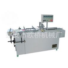 半自動(dòng)透明膜三維包裝機(jī)、煙條、香煙、化妝品包裝 安全套包裝機(jī)